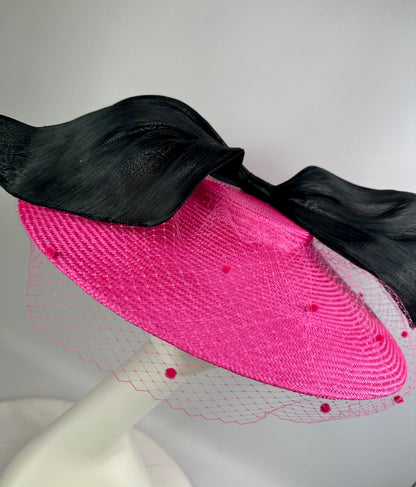 pink hat with black bow and veil 
