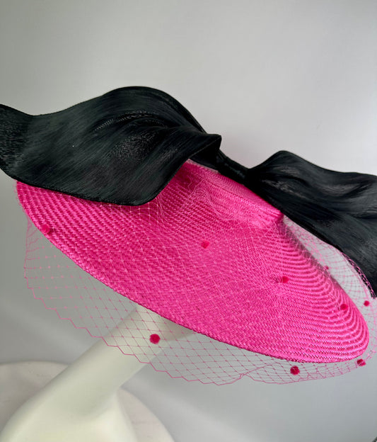 pink hat with black bow and veil 